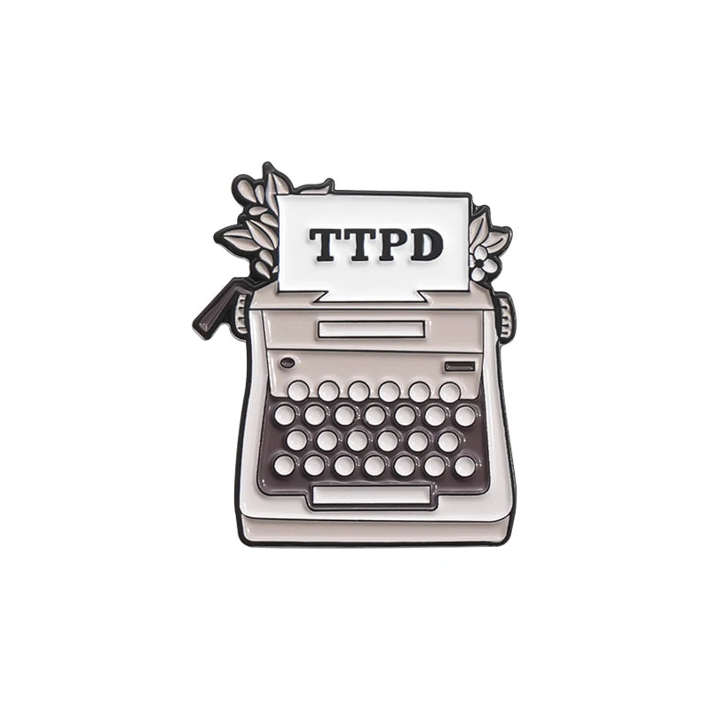 Broche Rock Swift : Bijou Émail Métal pour Fans Passionnés